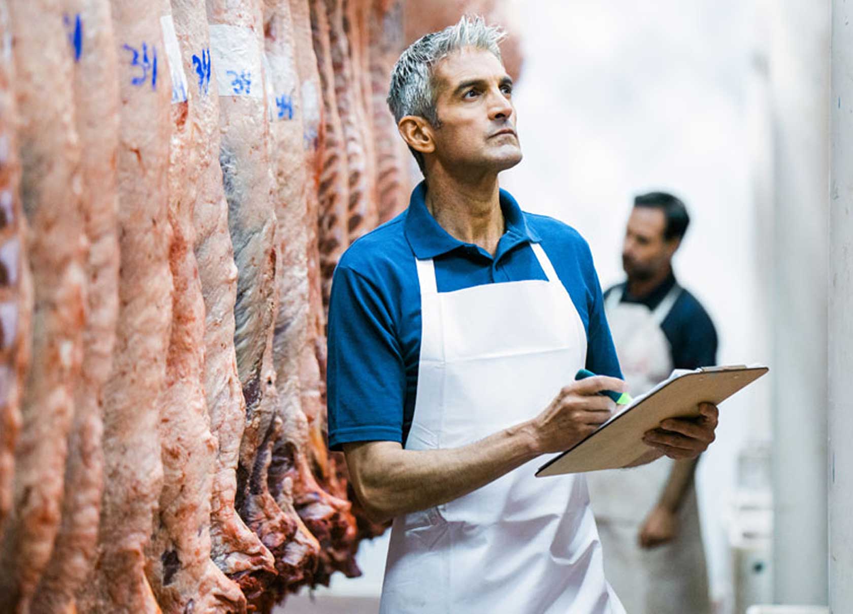 official meat inspector in a meat processing plant